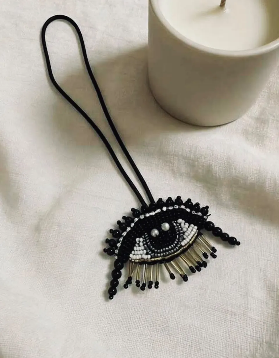 Black beaded eye charm