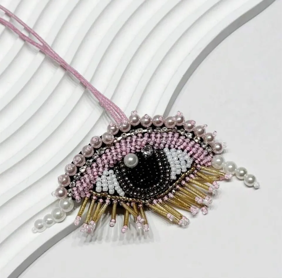 Pink beaded eye charm with pearls